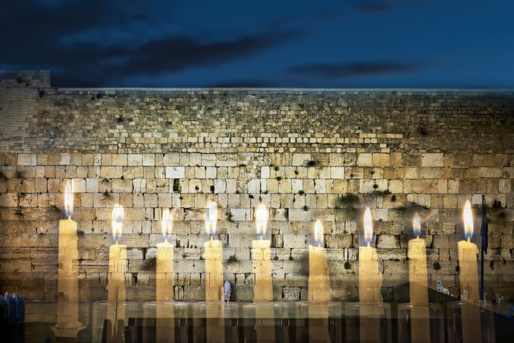 Western Wall with Hanukah menorah © Gorsh13 / iStock